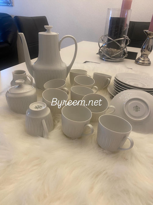 Elegant vintage coffee set in white